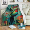 Colorful hummingbird blanket draped over a sofa in a cozy reading room setting