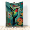 Colorful hummingbird throw blanket displayed upright with geometric shapes and floral artwork