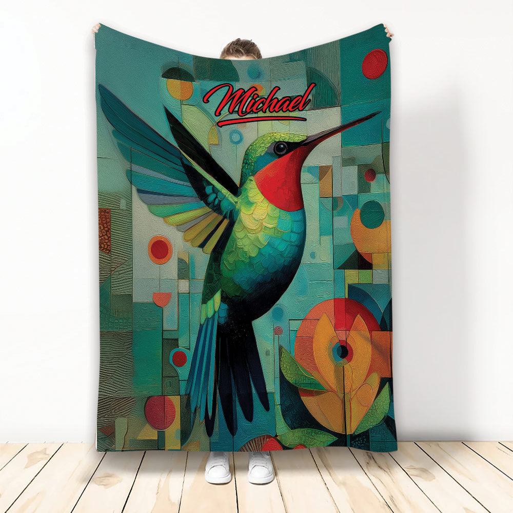 Colorful hummingbird throw blanket displayed upright with geometric shapes and floral artwork