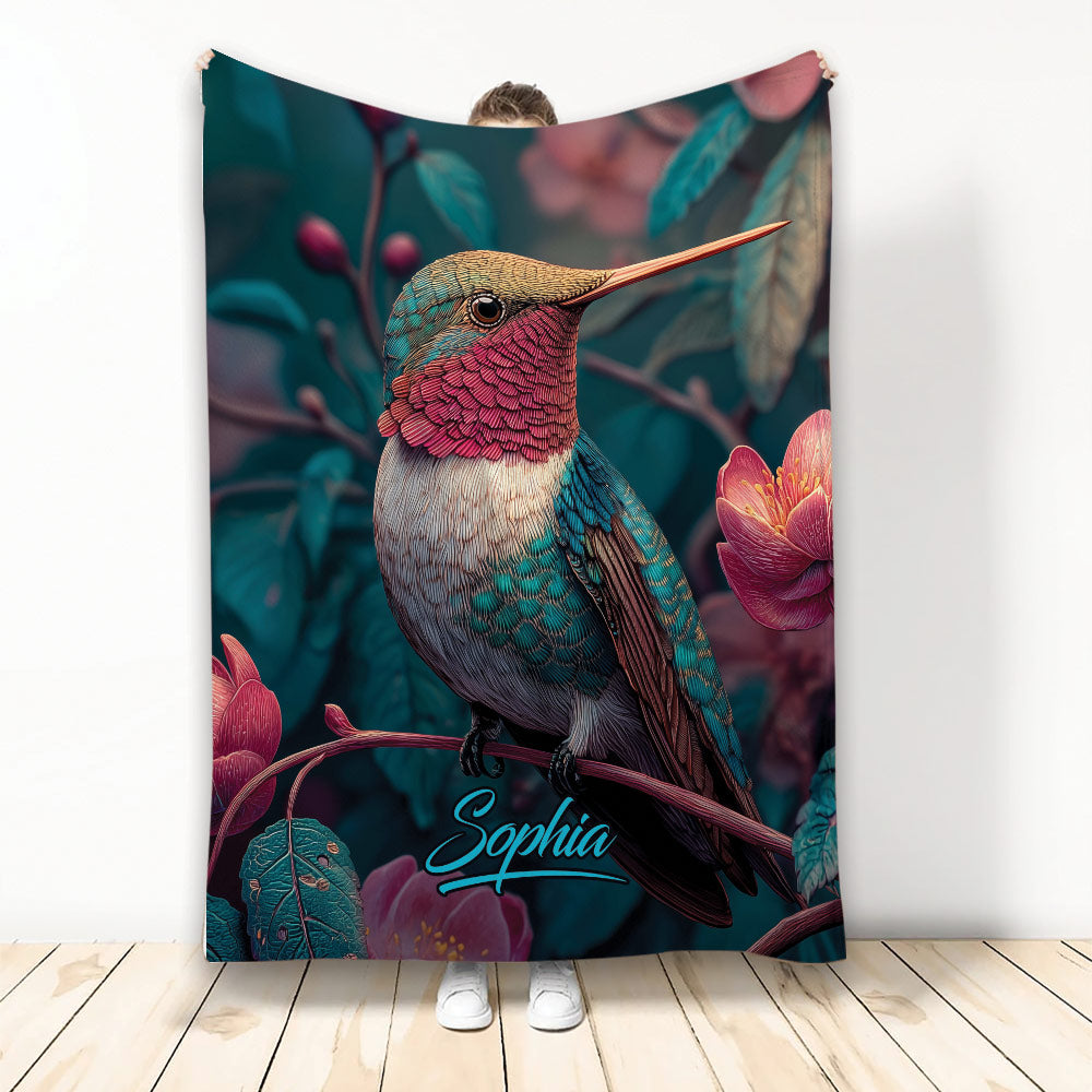 Colorful hummingbird blanket with tropical flowers and rich teal, pink, and copper artwork