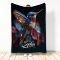 Jewel-toned hummingbird blanket with colorful flowers on a dramatic black background