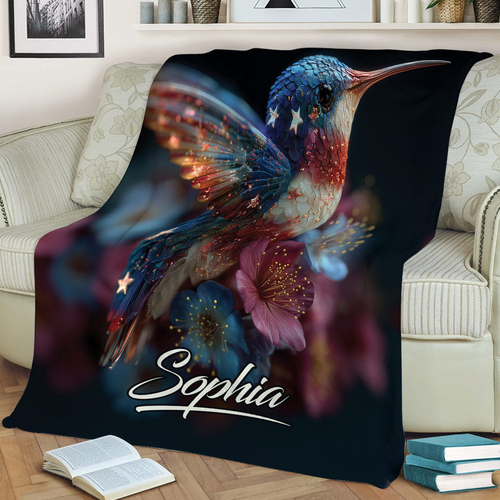 Colorful hummingbird and flower throw blanket styled across a living room sofa