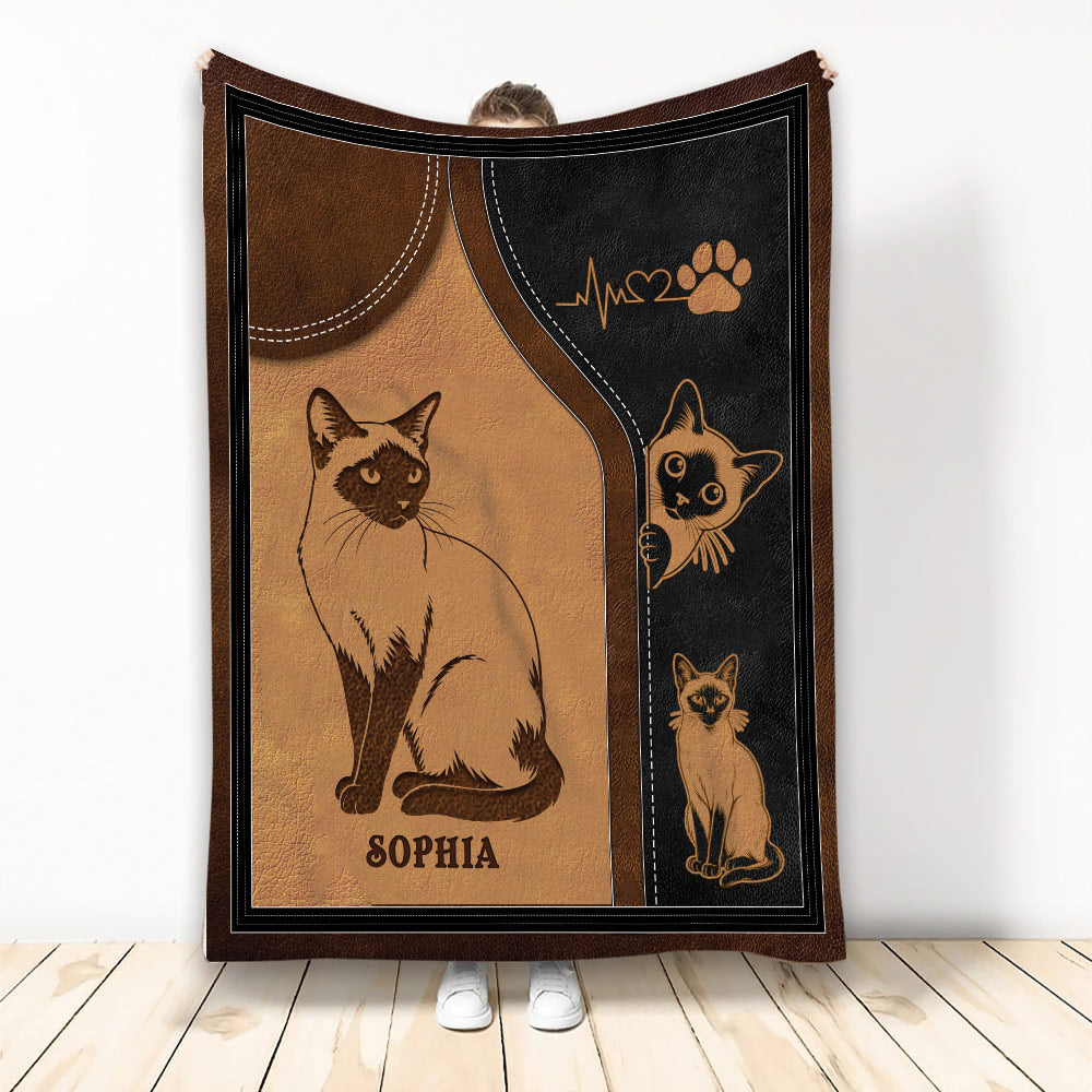 Siamese cat throw blanket displayed with illustrated cats, warm brown tones, black accents, and paw print artwork