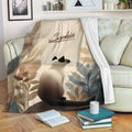 Siamese cat throw blanket draped over a sofa in a cozy reading room