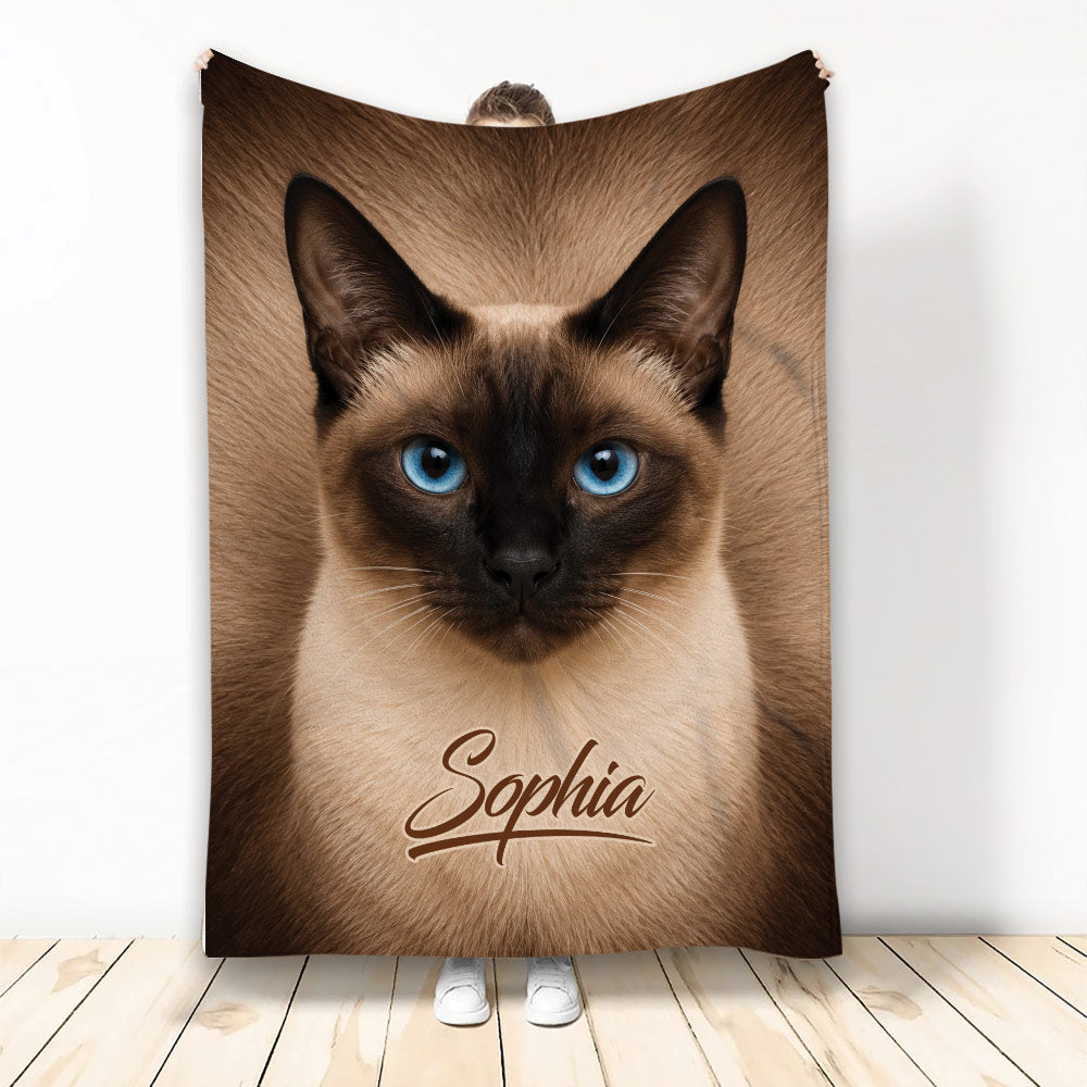 Siamese cat throw blanket featuring a close-up blue-eyed cat design in warm brown and cream tones