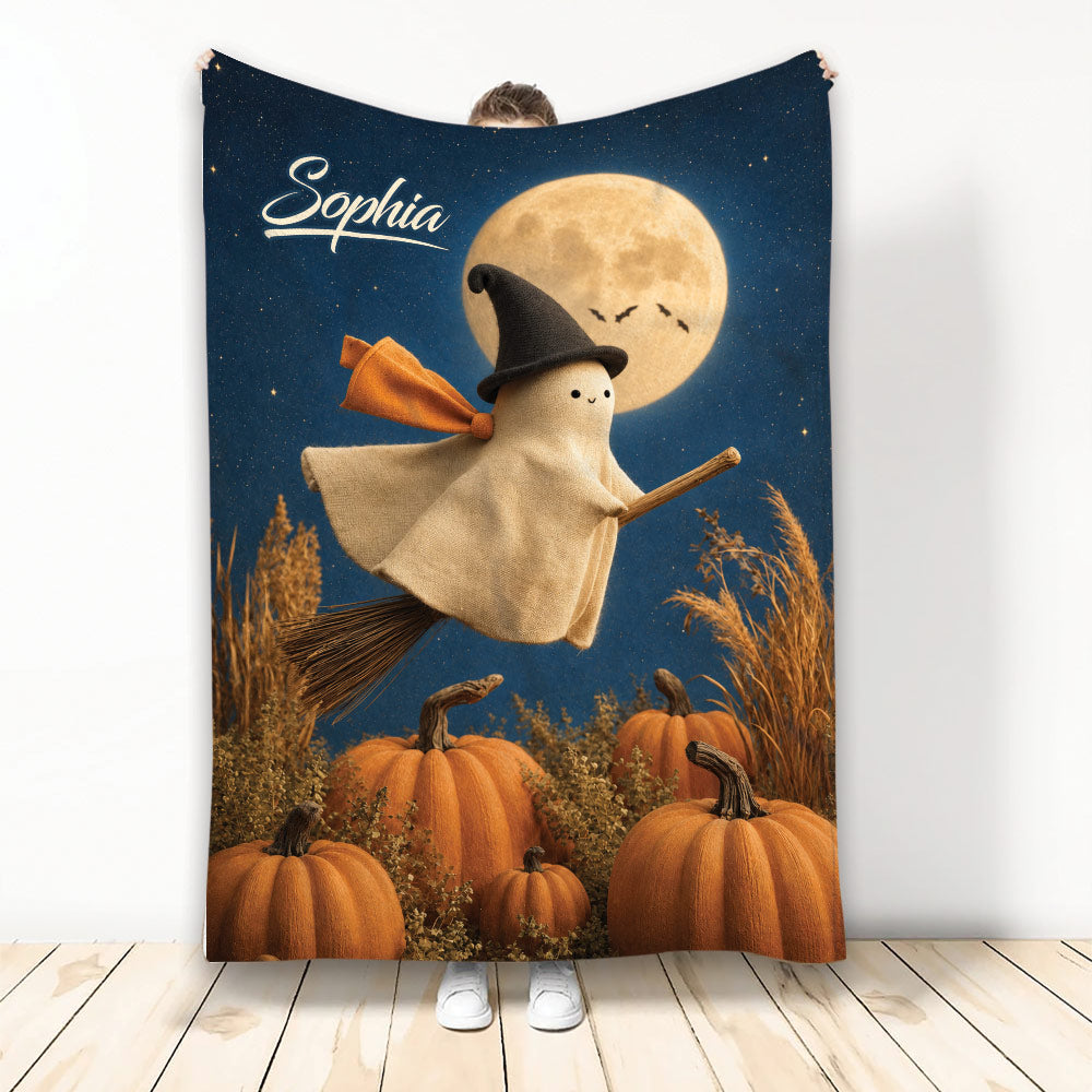 Halloween blanket featuring a friendly ghost witch on a broom above pumpkins under a moonlit sky