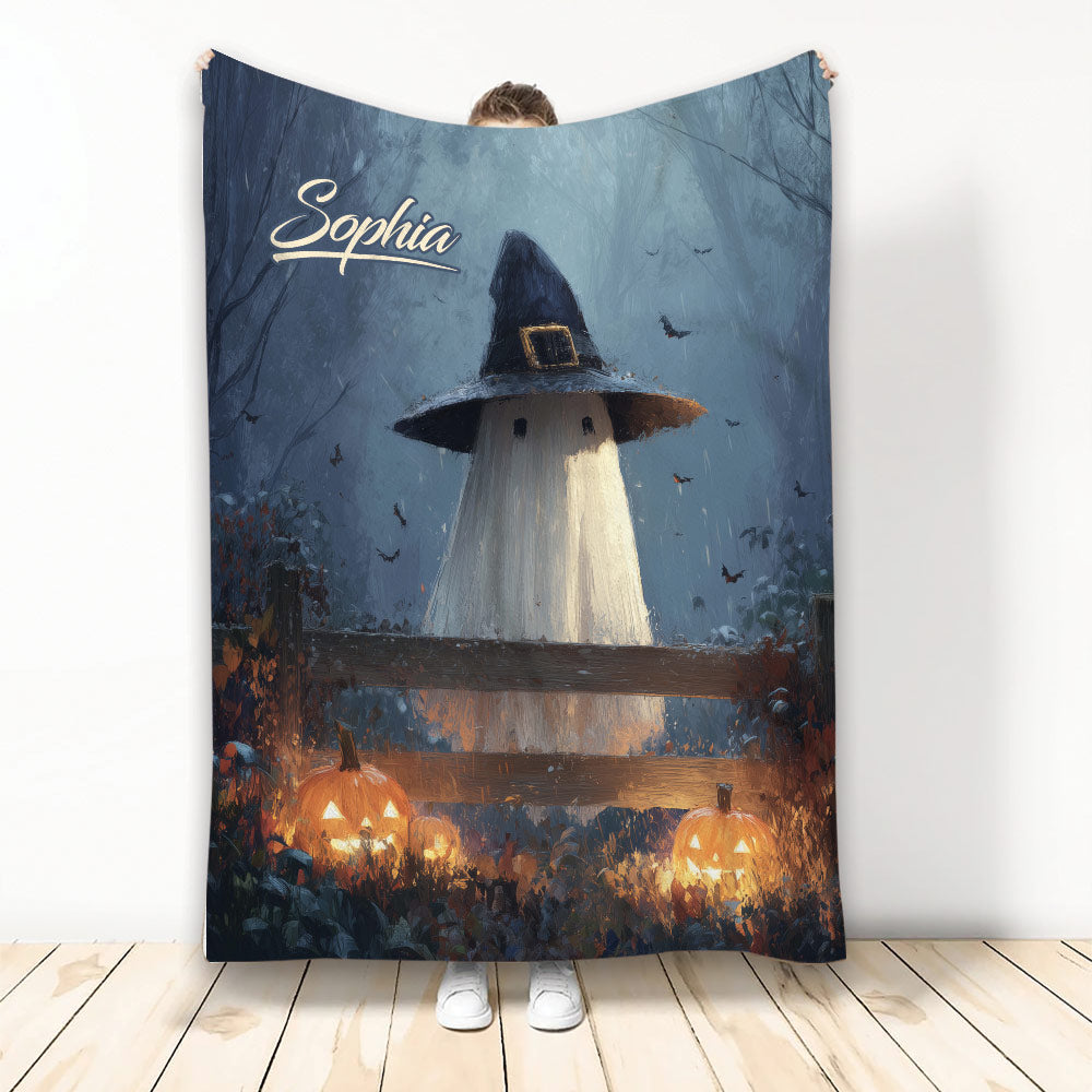 Halloween blanket featuring a ghost in a witch hat, bats, glowing pumpkins, and a spooky blue forest