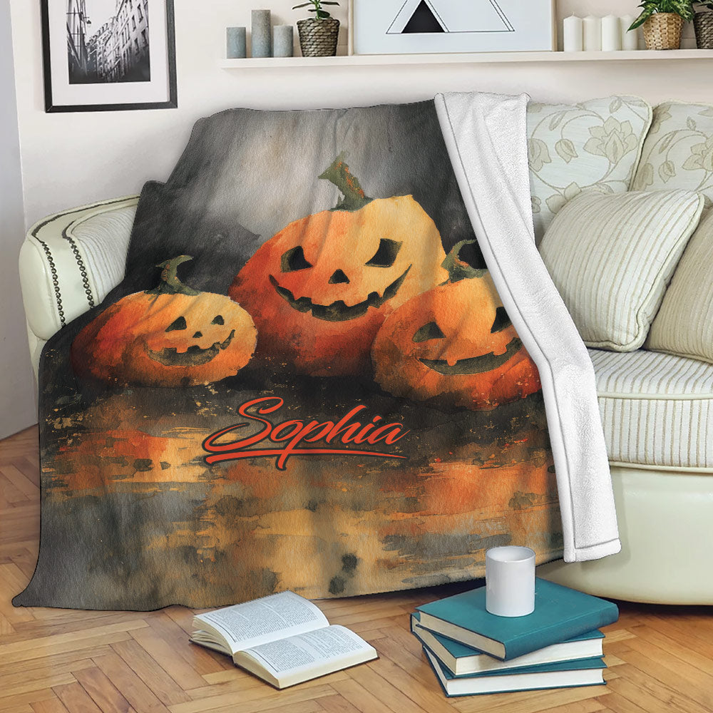 Halloween pumpkin throw blanket draped over a sofa in a cozy living room