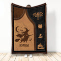 Halloween blanket featuring a flying witch, bats, crescent moon, spiderweb, cauldron, and pumpkin artwork