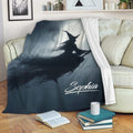 Halloween witch throw blanket draped over a sofa in a cozy living room setting