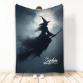 Halloween blanket with a witch silhouette flying across a full moon in a dark blue night scene