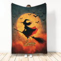 Halloween witch blanket with flying bats, glowing orange moon, broomstick, and spooky artwork