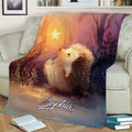 Hedgehog throw blanket displayed on a sofa with colorful forest artwork and a softly glowing star