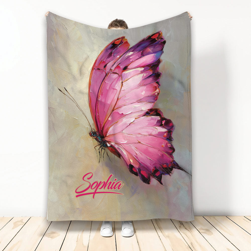 Pink butterfly artwork on a custom blanket shown draped for display
