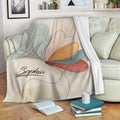 Colorful butterfly throw blanket draped over a sofa in a cozy living room