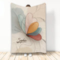 Colorful butterfly line art on a custom throw blanket displayed against a light background