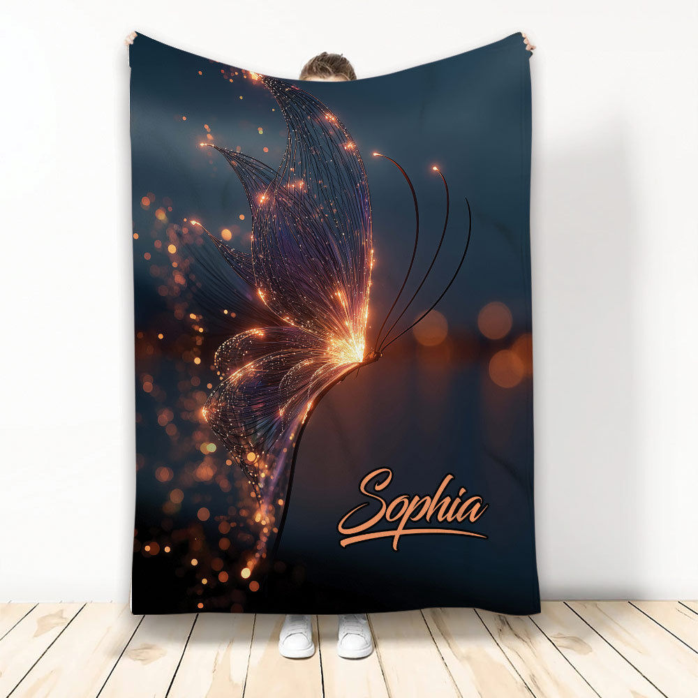 Glowing butterfly throw blanket displayed upright with luminous orange accents on a dark blue design