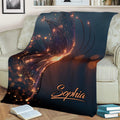 Butterfly throw blanket styled on a sofa, featuring luminous wings and warm glowing accents