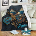 Ornate blue butterfly throw blanket draped across a cozy sofa in a living room