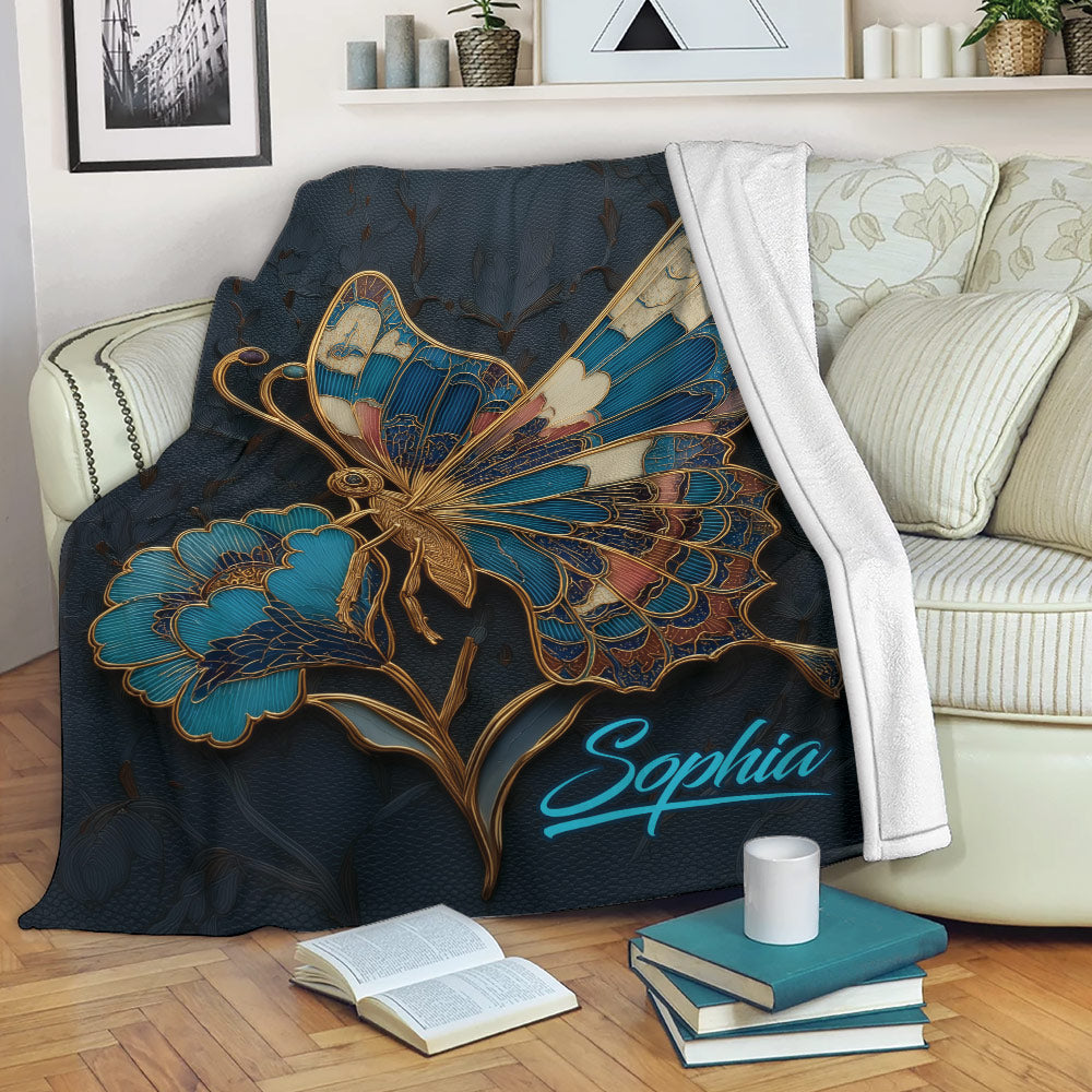 Ornate blue butterfly throw blanket draped across a cozy sofa in a living room