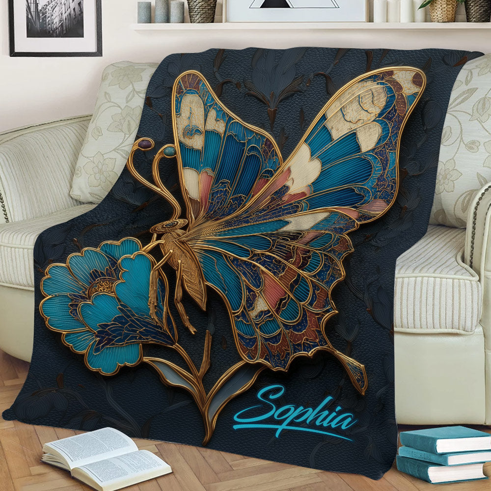 Large floral butterfly blanket displayed on a sofa with books and home decor
