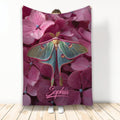 Colorful butterfly artwork on a deep pink floral throw blanket displayed against a light background