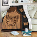 Butterfly and sunflower throw blanket displayed over a sofa in a cozy living room