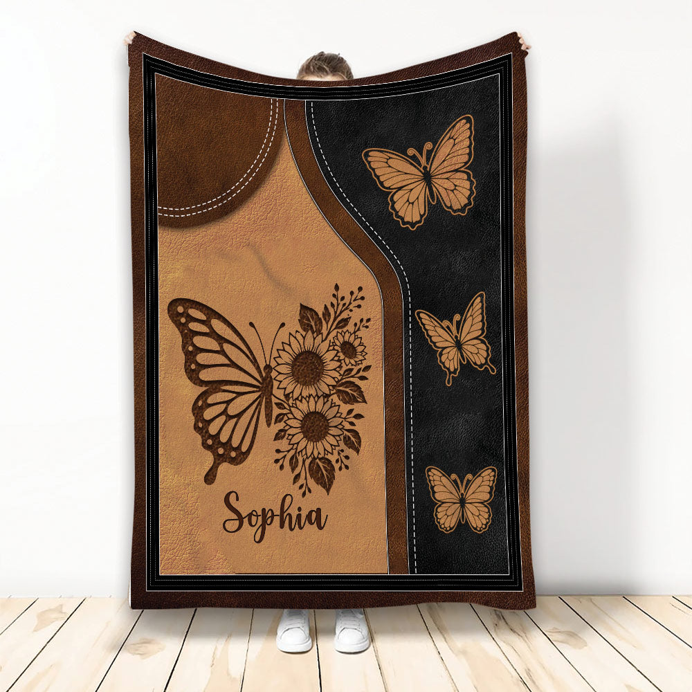 Butterfly throw blanket with sunflower artwork in warm brown, black, and golden tones