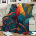 Close view of a vivid parrot throw blanket styled across a living room sofa