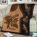 Close view of a parrot throw blanket featuring detailed bird illustrations and tropical flowers
