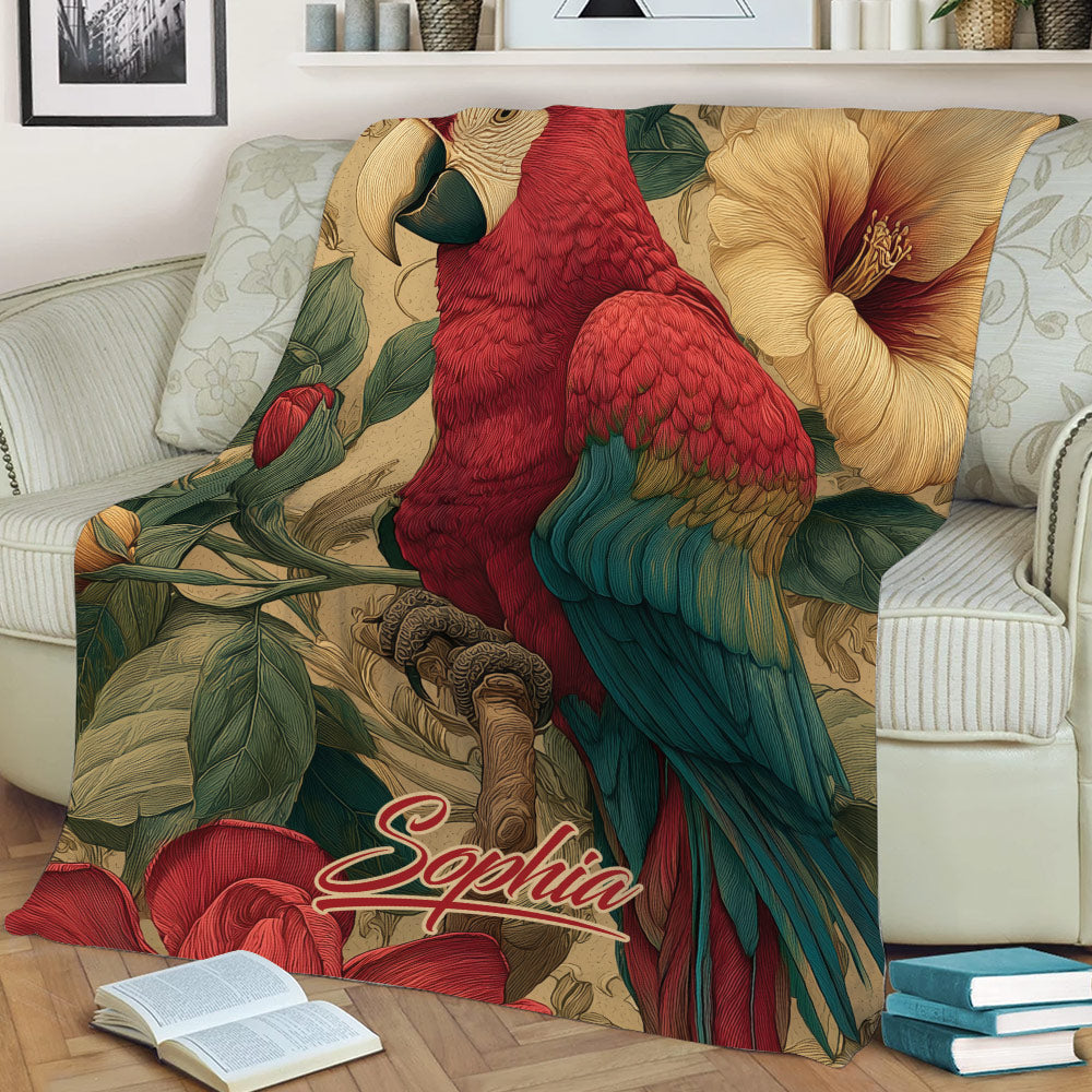 Colorful parrot throw blanket displayed on a sofa with bold macaw and botanical flower design