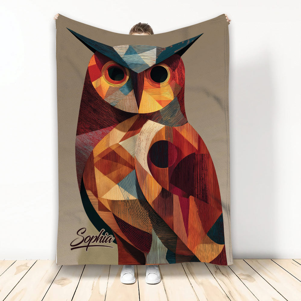 Colorful geometric owl throw blanket displayed against a neutral background