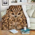 Owl throw blanket draped across a sofa in a cozy reading room setting