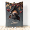 Custom bat throw blanket featuring an upside-down bat with autumn leaves and red berries