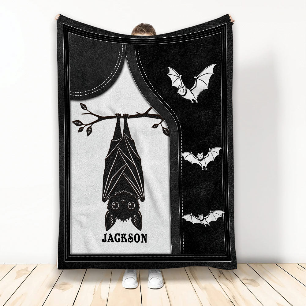 Black and white bat throw blanket displayed upright with a large hanging bat and smaller flying bats