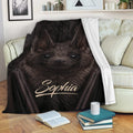 Dark brown bat blanket draped over a sofa in a cozy living room reading space