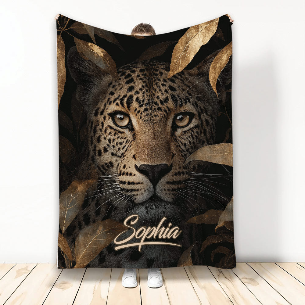 Leopard throw blanket with dramatic big cat artwork, dark foliage, and warm gold accents