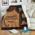 Leopard blanket draped over a sofa with reclining and cub leopard artwork in a cozy living room