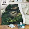 Gorilla blanket displayed on a sofa with bold jungle artwork and leafy surroundings