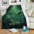 Green spider throw blanket draped over a sofa in a cozy living room setting