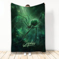 Green cosmic spider blanket displayed upright with web details and dramatic glowing artwork