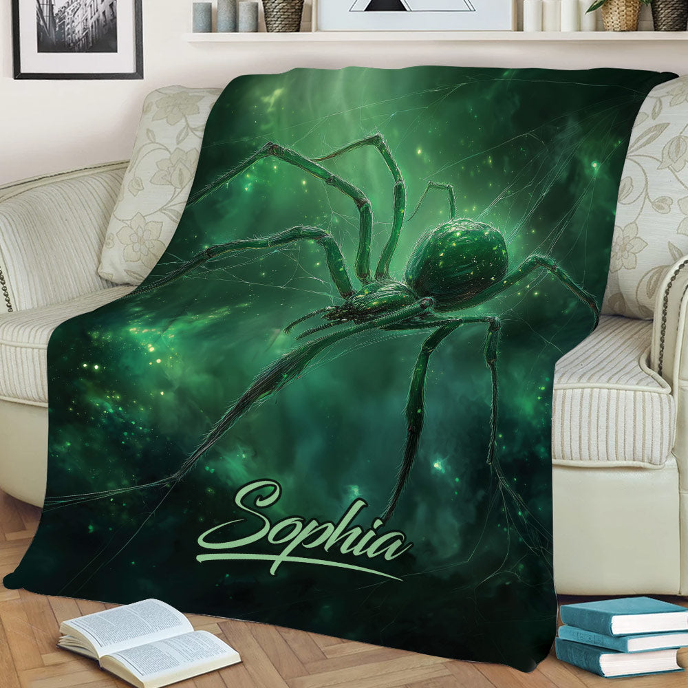 Large green spider blanket styled across a sofa with glowing web-inspired artwork