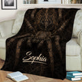 Large spider throw blanket displayed across a sofa with dramatic dark brown wildlife artwork