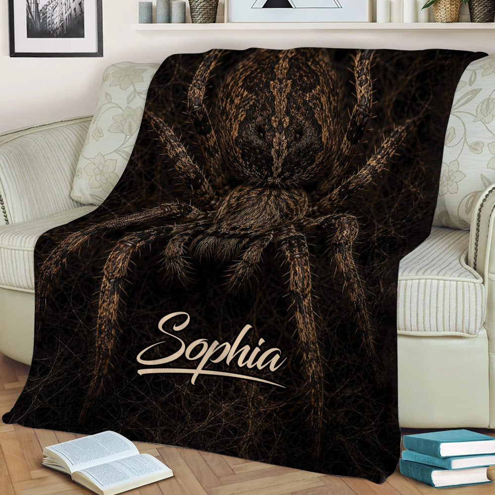 Large spider throw blanket displayed across a sofa with dramatic dark brown wildlife artwork