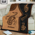 Close view of saxophone and musical note artwork on a living room throw blanket