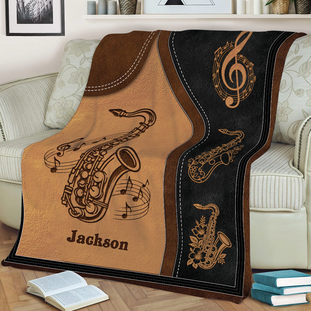 Close view of saxophone and musical note artwork on a living room throw blanket