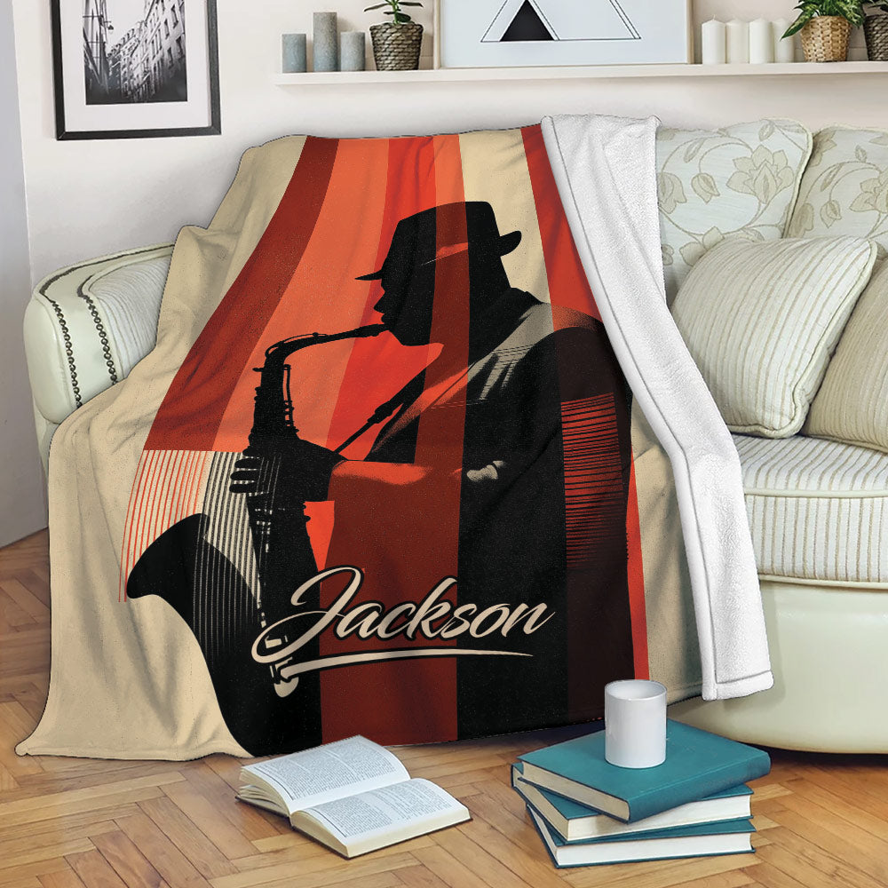 Saxophone blanket draped over a sofa, featuring a silhouetted musician and warm red retro design