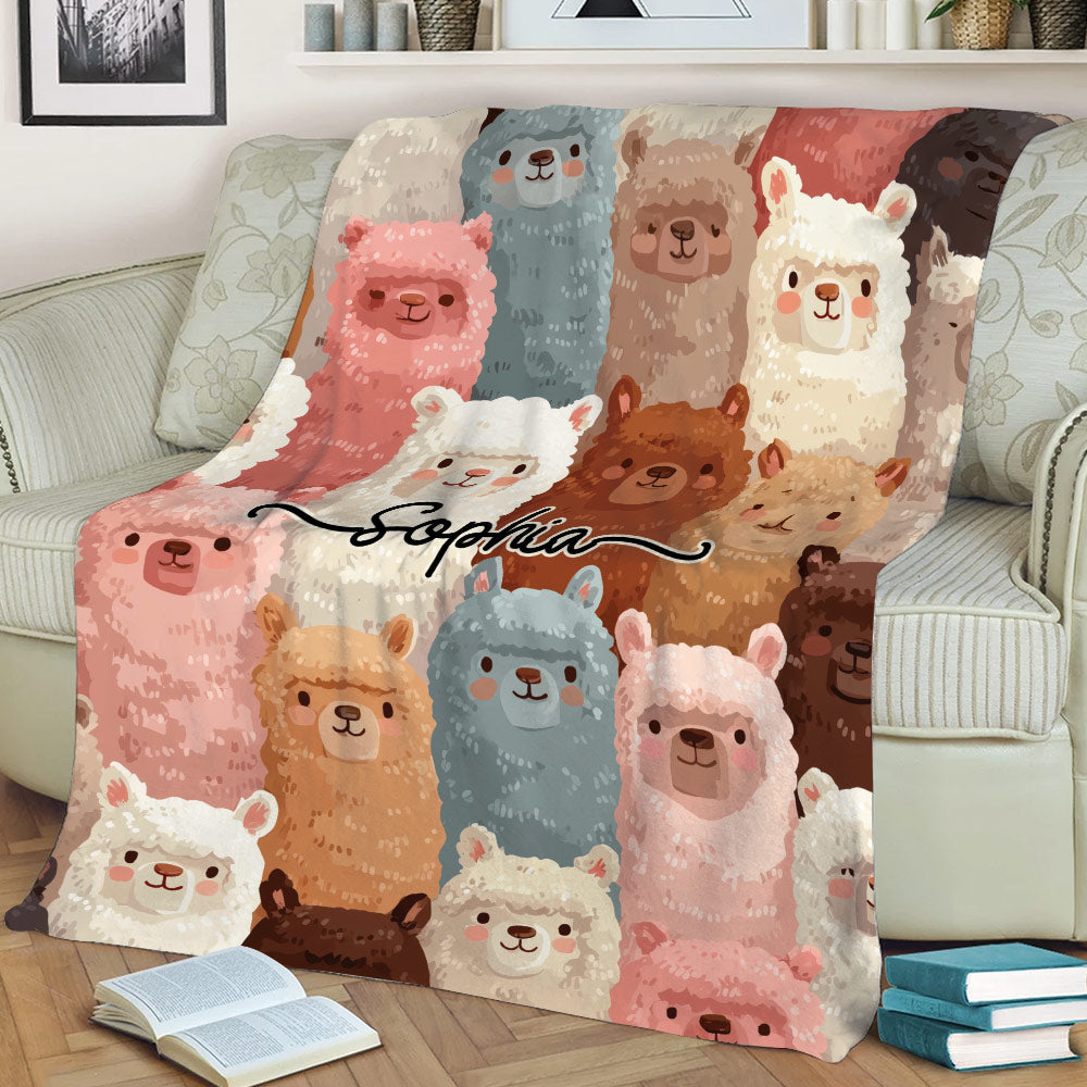 Llama throw blanket spread across a sofa with playful illustrated llamas in varied colors