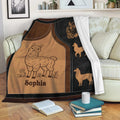 Custom llama blanket draped over a sofa with warm brown artwork and decorative llama silhouettes