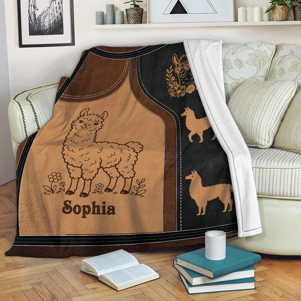 Custom llama blanket draped over a sofa with warm brown artwork and decorative llama silhouettes